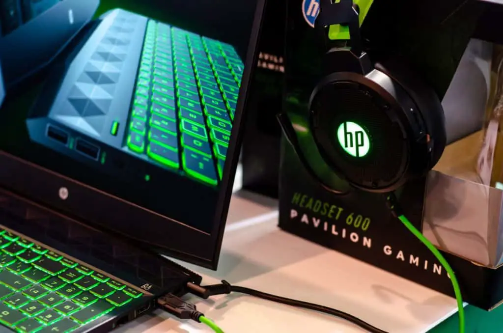 Close-up of HP laptop and headphones