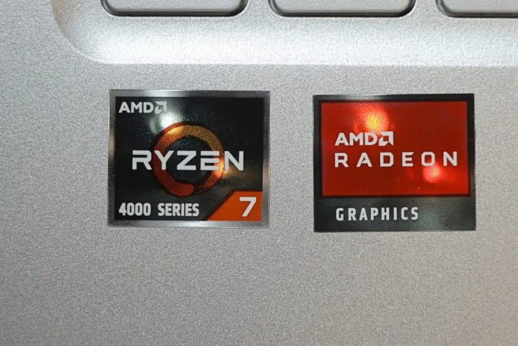 AMD RYZEN 7 4000 series CPU and AMD RADEON graphic card stickers on a silver laptop