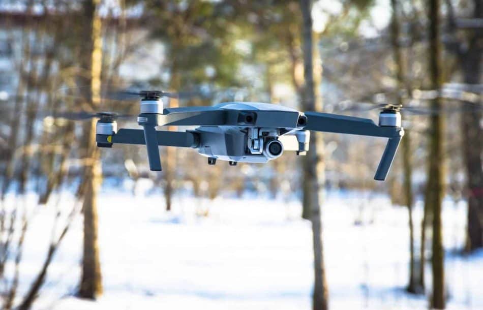 drone flying over snow up close