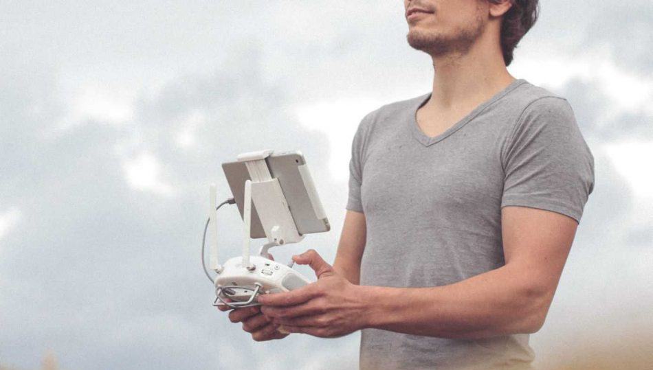 man controlling a drone