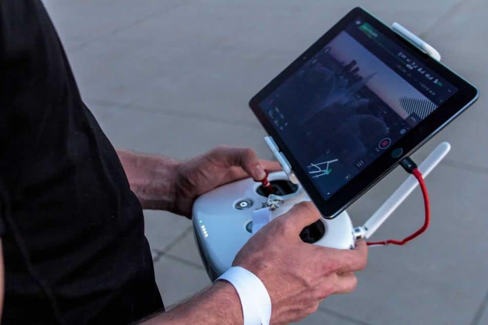 man with drone remote and screen