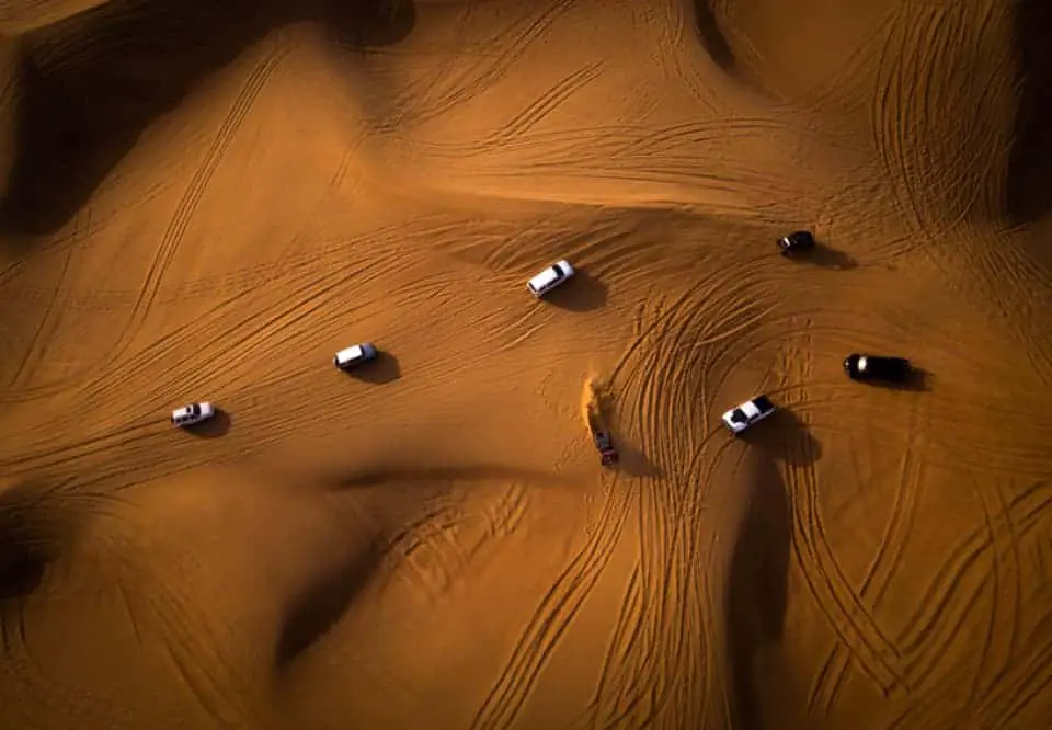cars driving through desert