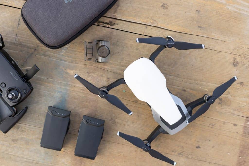 Mavic Air quadcopter 4k camera drone with batteries on the table