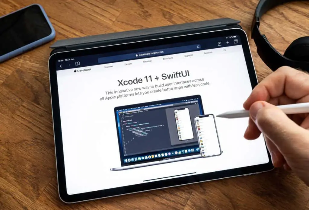 Man reading on iPad Pro WWDC 19 Xcode 11 and SwiftUI