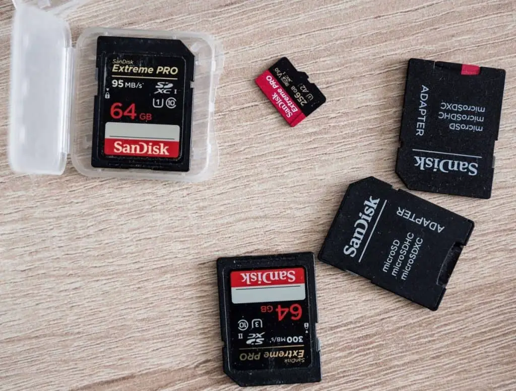 Sandisk SD memory cards on table and microSD adapter