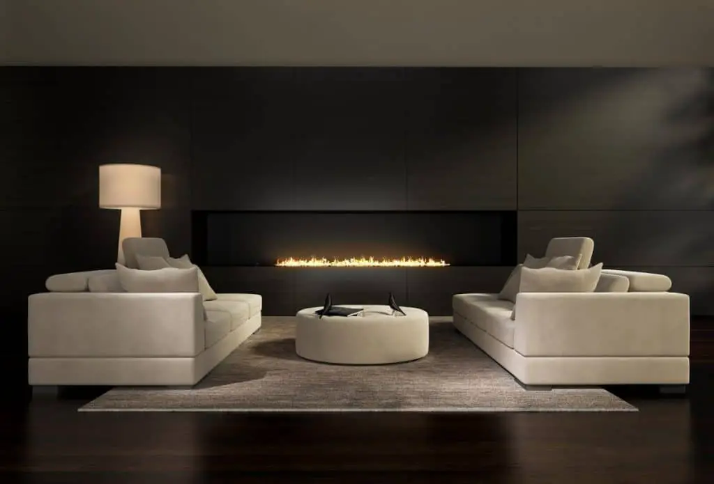 Dark contemporary interior, a living room with a flat gas fireplace