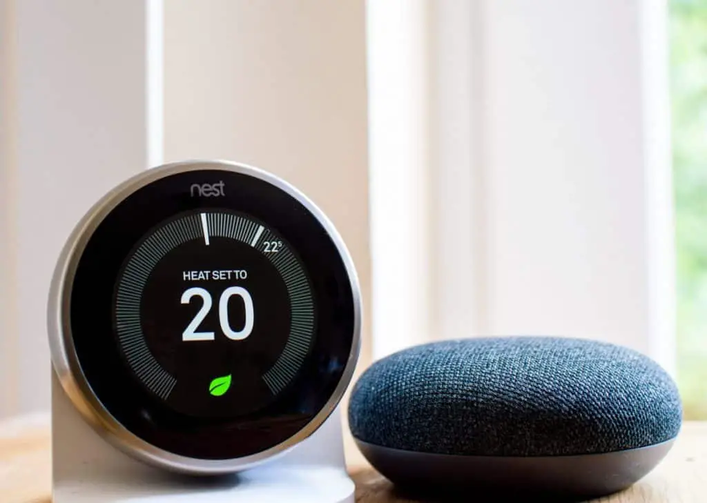 Nest smart thermostat and Google home mini speaker
