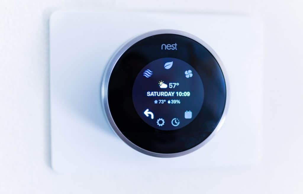 Nest smart thermostat on the wall