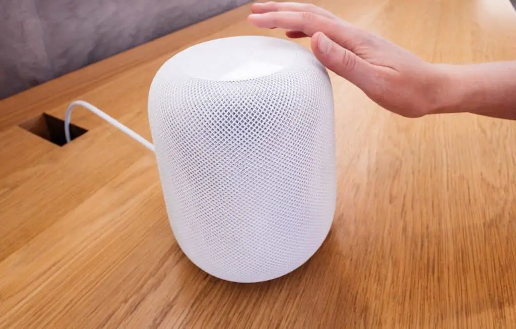 Woman testing lates Apple HomePod