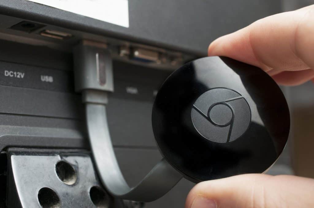 google chromecast device connected to a tv
