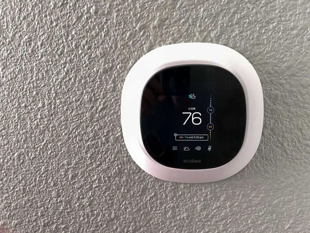 An Ecobee smart thermostat in a home