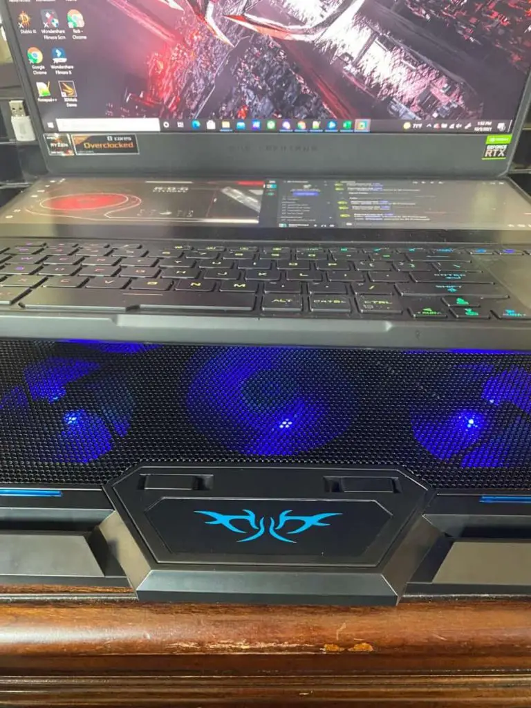 Cooler with laptop on it