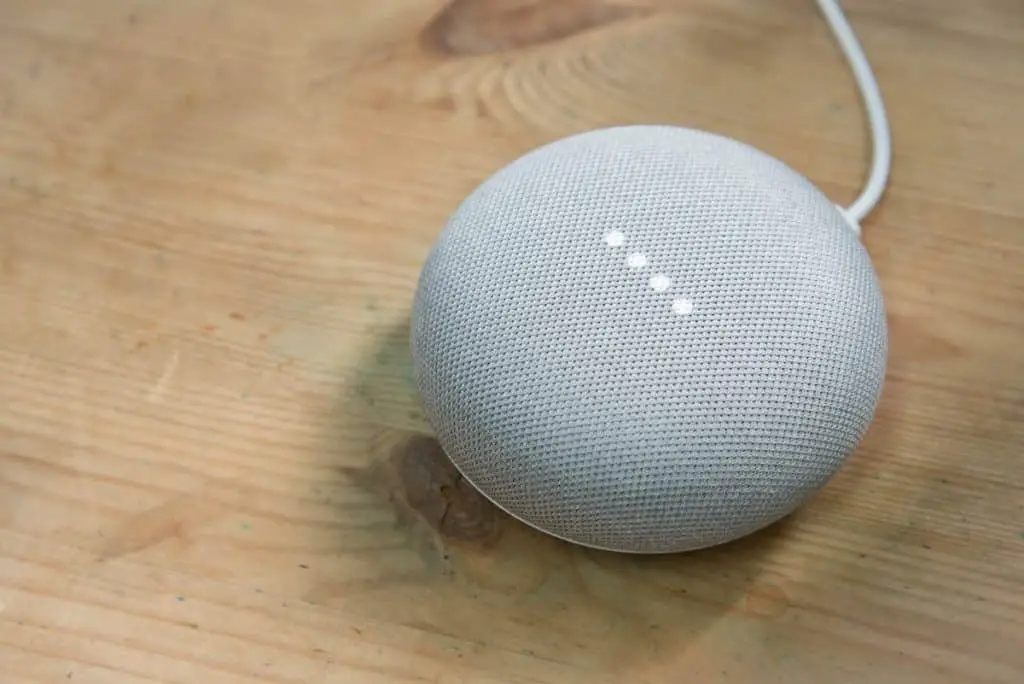 Google Home Mini Chalk color on a wooden surface
