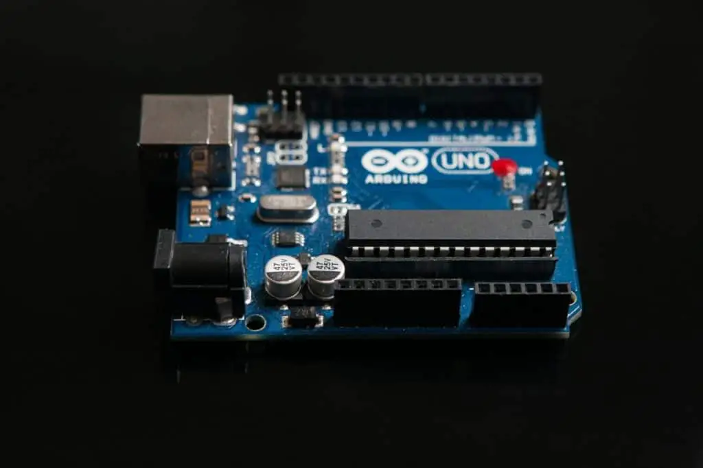 Arduino UNO board on black background