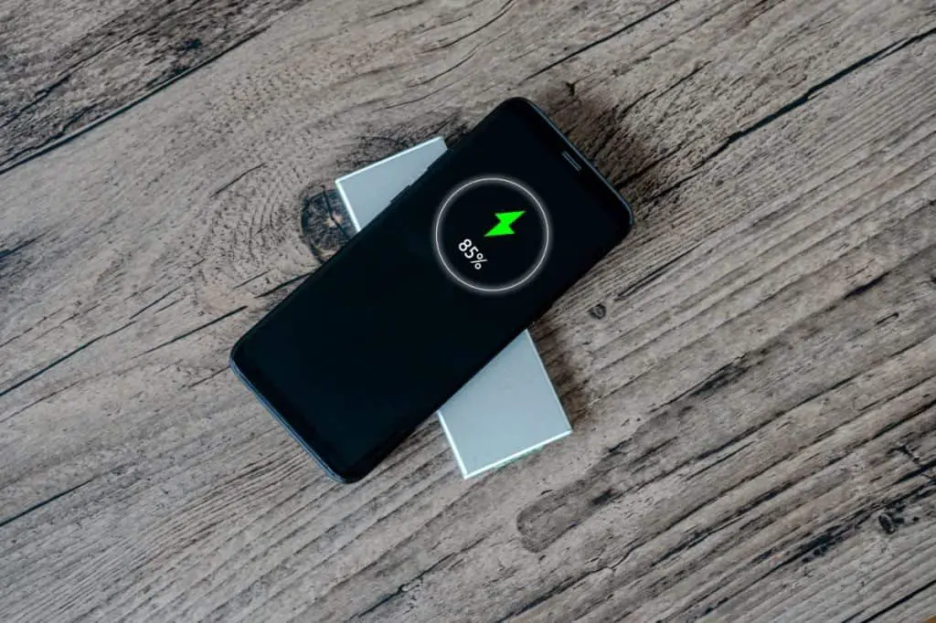 Wireless charging of smartphone on restaurant table